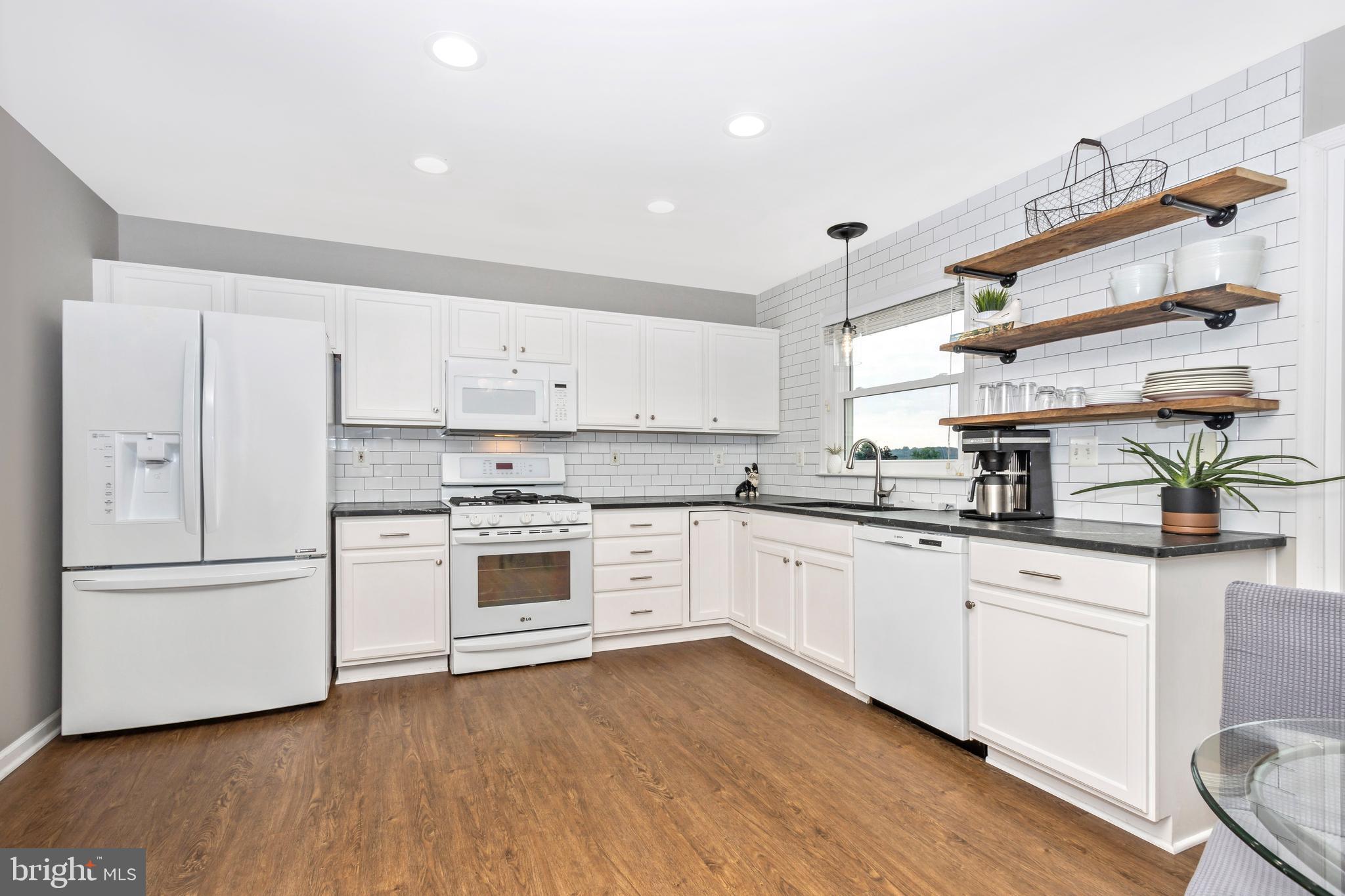 1408 Crossbow Road Mount Airy, MD 21771 - Photo 5 of 52 Updated kitchen Quartzite countertops, subway tile
