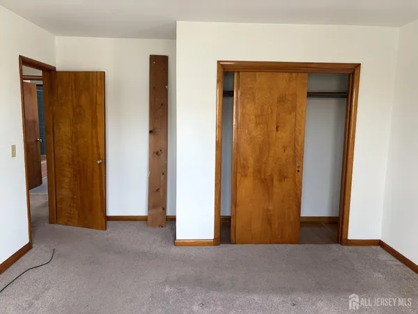 a view of room with wooden floor