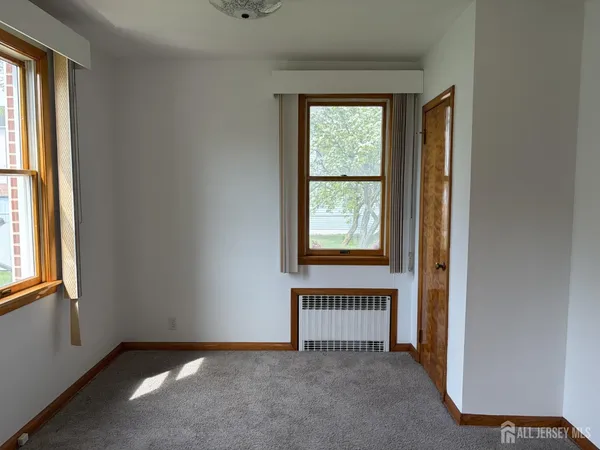 a view of a room with a large window