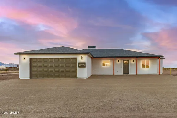 a front view of a house with a garage