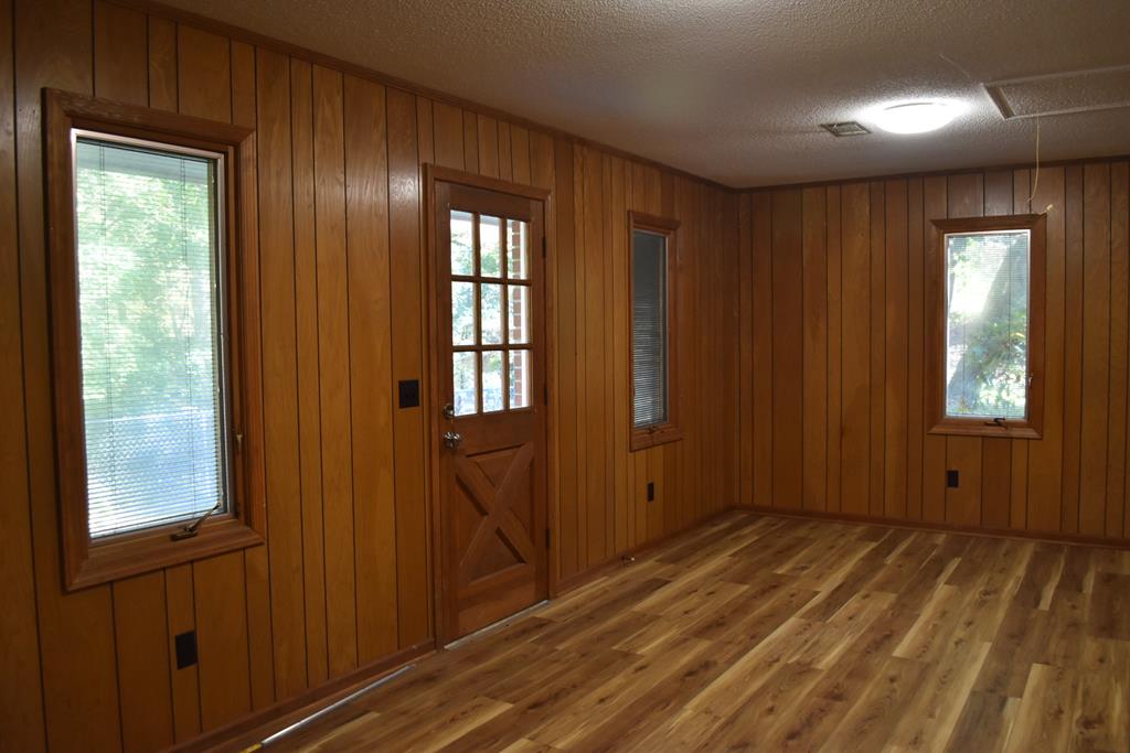 959 Pleasant Valley Road Murphy, NC 28906 - Photo 13 of 18 a view of an empty room with wooden floor and a window