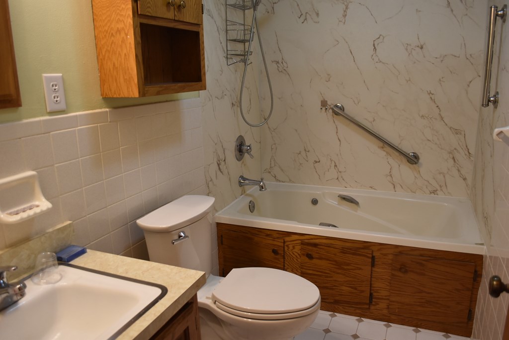 959 Pleasant Valley Road Murphy, NC 28906 - Photo 15 of 18 a bathroom with a sink a toilet and shower