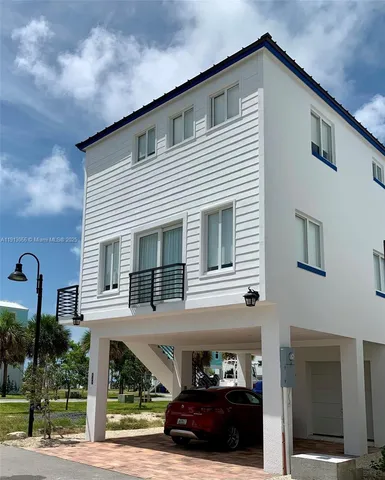 a view of a car park in front of house
