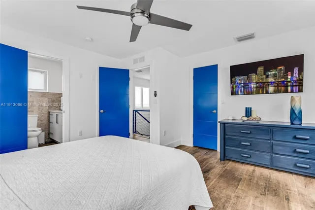 a bedroom with a bed and a dresser