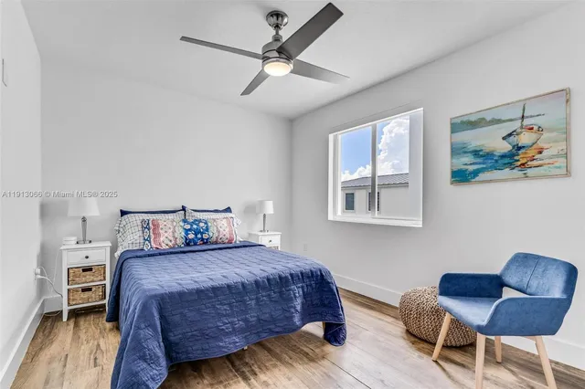 a bedroom with a bed and a chair