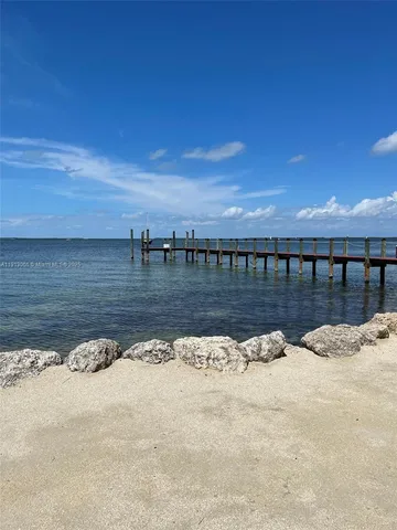 a view of an chairs and table in the patio