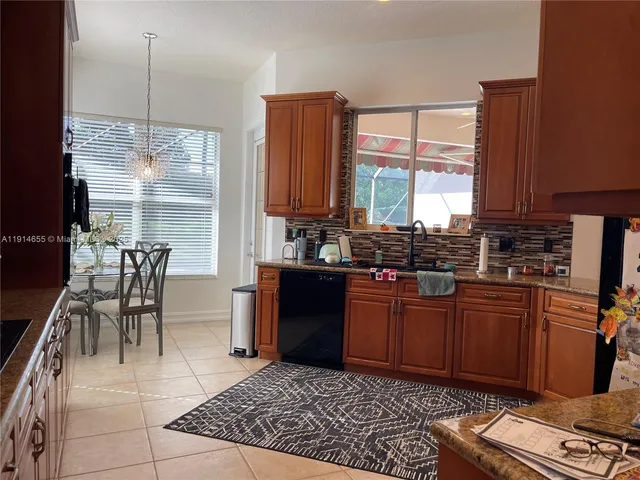 a bedroom with a bed and a television