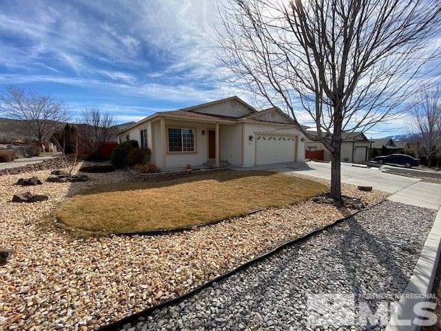 18020 Hazelnut Drive Reno, NV 89508 - Photo 1 of 19 a view of a house with a yard covered in snow