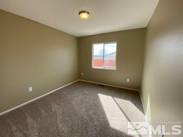 18020 Hazelnut Drive Reno, NV 89508 - Photo 16 of 19 an empty room with windows