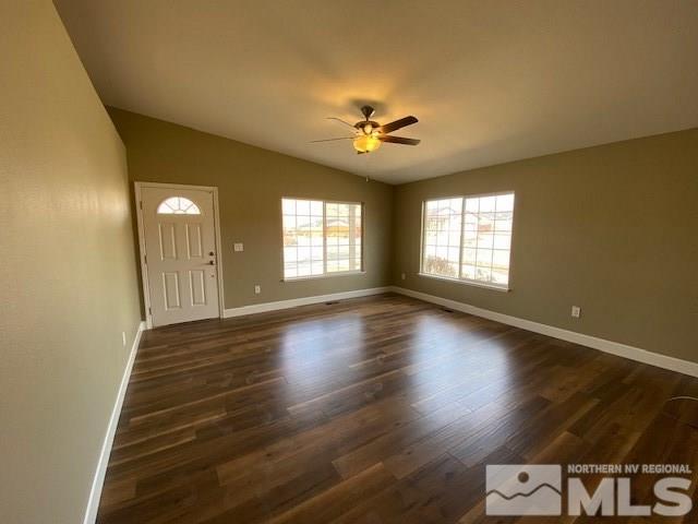 18020 Hazelnut Drive Reno, NV 89508 - Photo 3 of 19 a view of an empty room with glass door and wooden floor