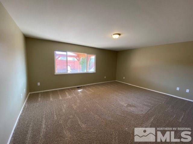 18020 Hazelnut Drive Reno, NV 89508 - Photo 7 of 19 an empty room with windows