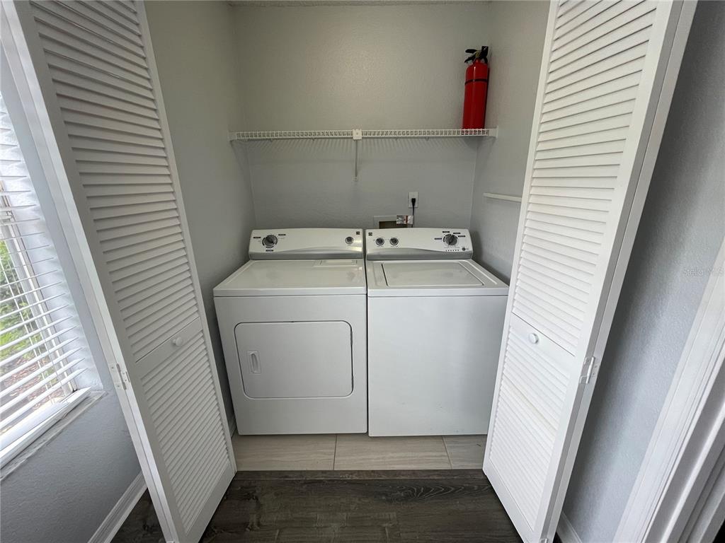 5128 Conroy Road, Unit 13 Orlando, FL 32811 - Photo 11 of 25 a utility room with dryer and washer