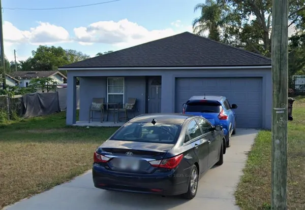 a car parked in front of a house