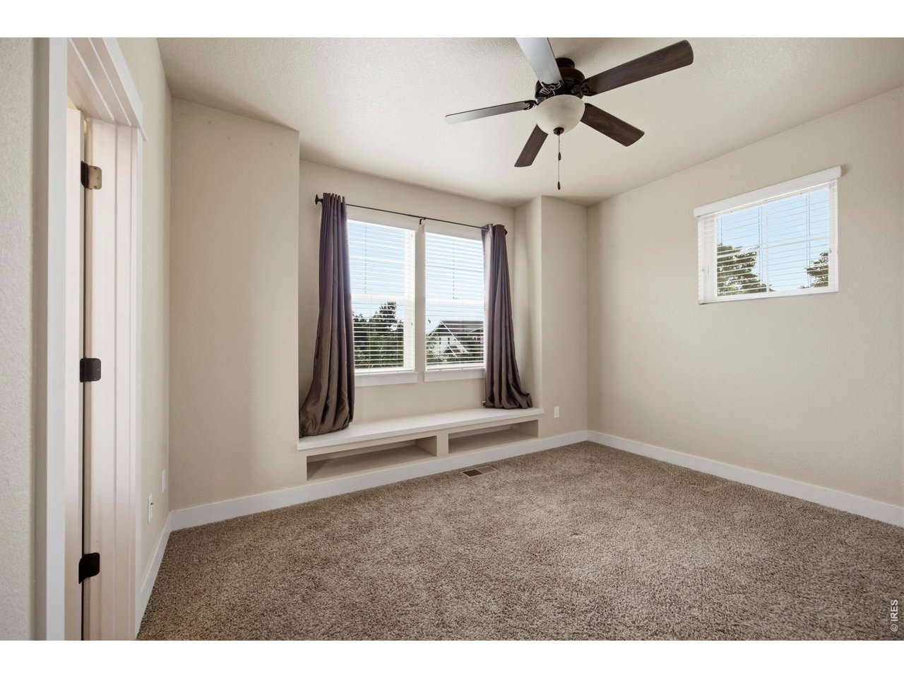 2163 Scarecrow Road Fort Collins, CO 80525 - Photo 18 of 25 Second Bedroom with Window Seat