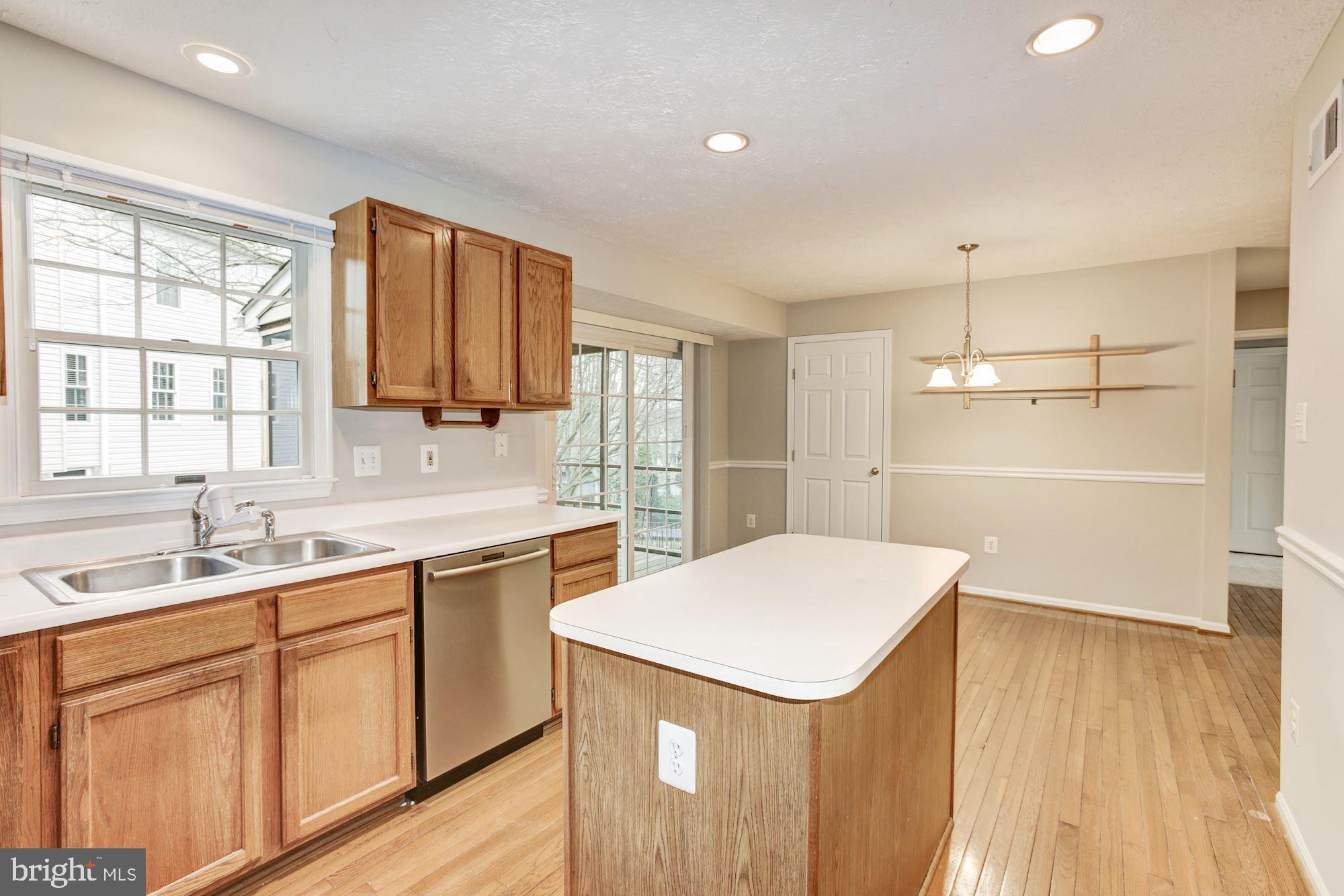 6420 Ripe Apple Lane Columbia, MD 21044 - Photo 6 of 26 Dining room leads to the screened in porch