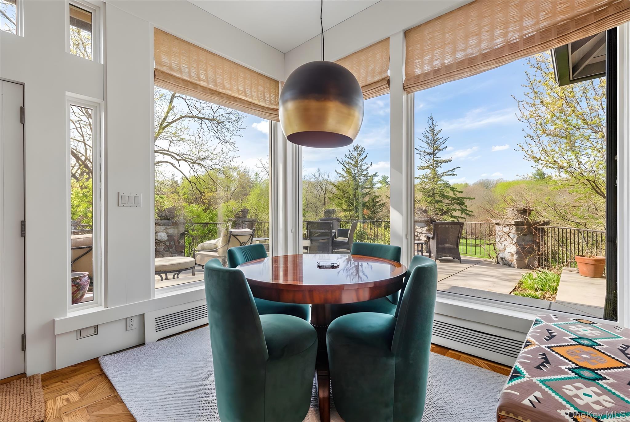 150 Old Farm Road North Chappaqua, NY 10514 - Photo 12 of 44 a dining room with furniture a chandelier and wooden floor