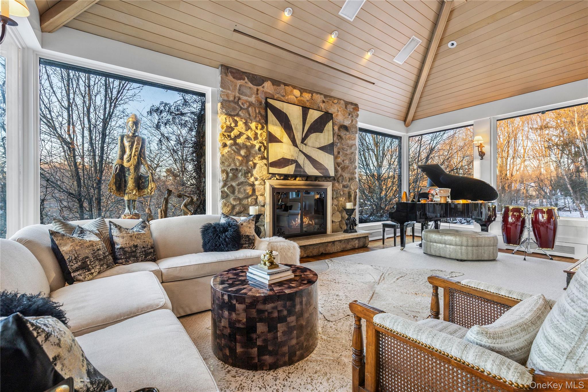 150 Old Farm Road North Chappaqua, NY 10514 - Photo 14 of 44 a living room with furniture a large window and a fireplace