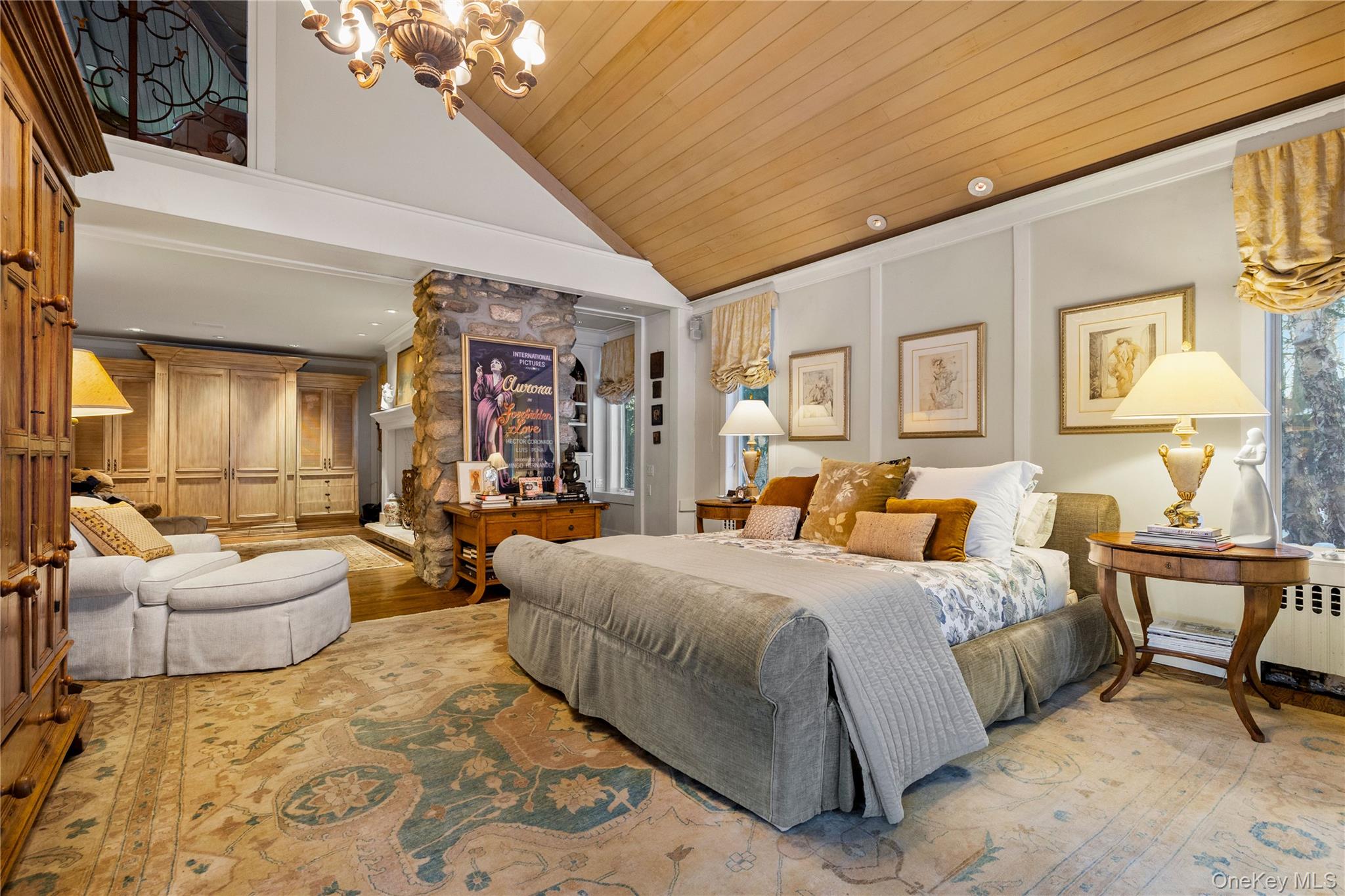 150 Old Farm Road North Chappaqua, NY 10514 - Photo 22 of 44 a bedroom with a bed couches and a flat tv screen