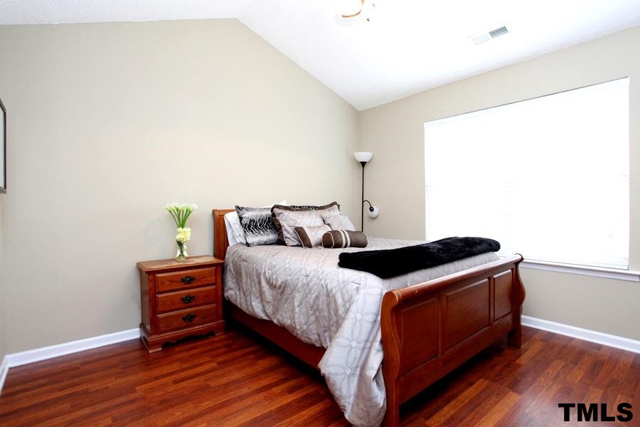5416 Golden Moss Trail Raleigh, NC 27613 - Photo 12 of 25 The First Floor Master Suite is a Treat with More Laminate Flooring and Spacious Room for Furniture!