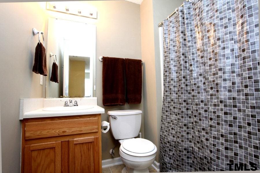 5416 Golden Moss Trail Raleigh, NC 27613 - Photo 17 of 25 This Full Bath has Stylish Tile Floor & Storage Cabinet too!