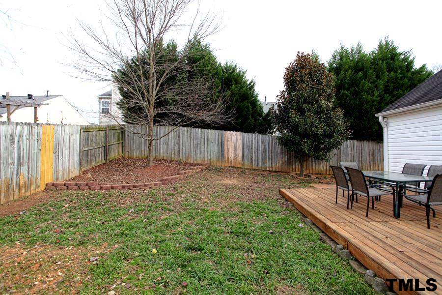 5416 Golden Moss Trail Raleigh, NC 27613 - Photo 23 of 25 A Private Fence Surrounds the Back Yard - giving a Feel of Privacy as You Enjoy the Deck and More!