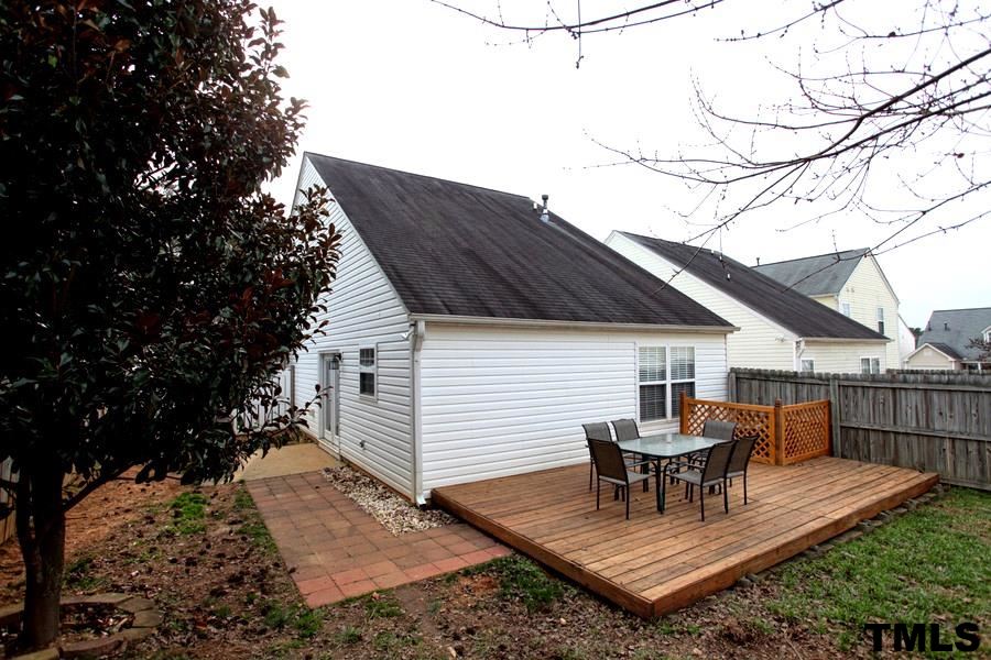 5416 Golden Moss Trail Raleigh, NC 27613 - Photo 24 of 25 Lots of Possiblities for Outdoor Living - the Patio and Grill that Conveniently Flows from Kitchen French Doors, the Adorable Sidewalk, and the Spacious Deck!