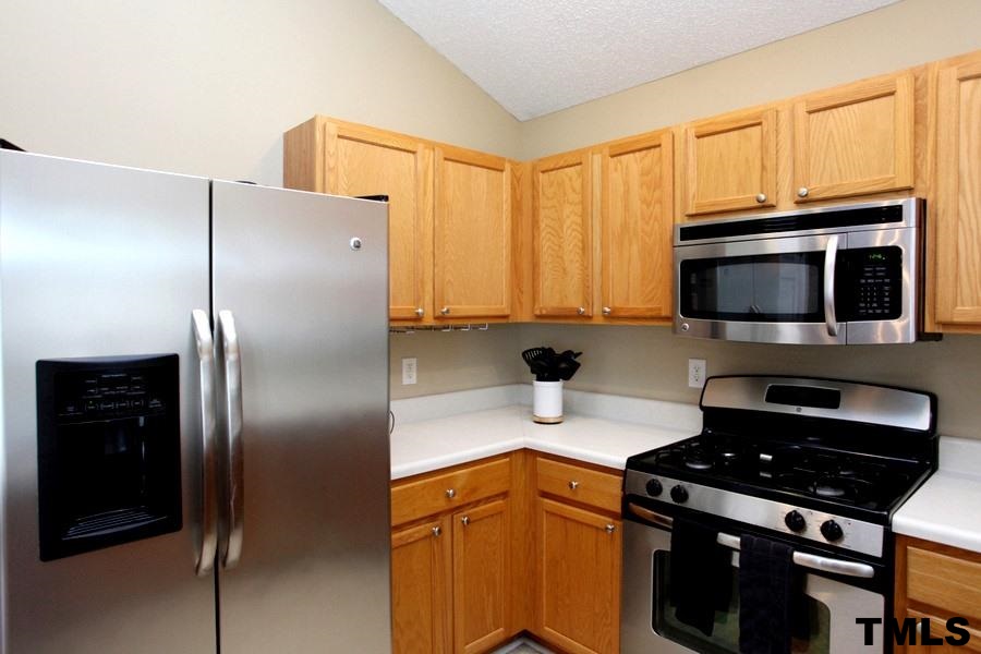 5416 Golden Moss Trail Raleigh, NC 27613 - Photo 10 of 25 Stainless Steel Appliances are the Star of the Kitchen! Gas top Stove and Space Saver Built-in Microwave too!