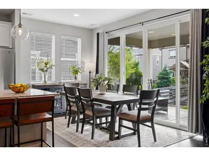 a view of a dining room with furniture window and outside view