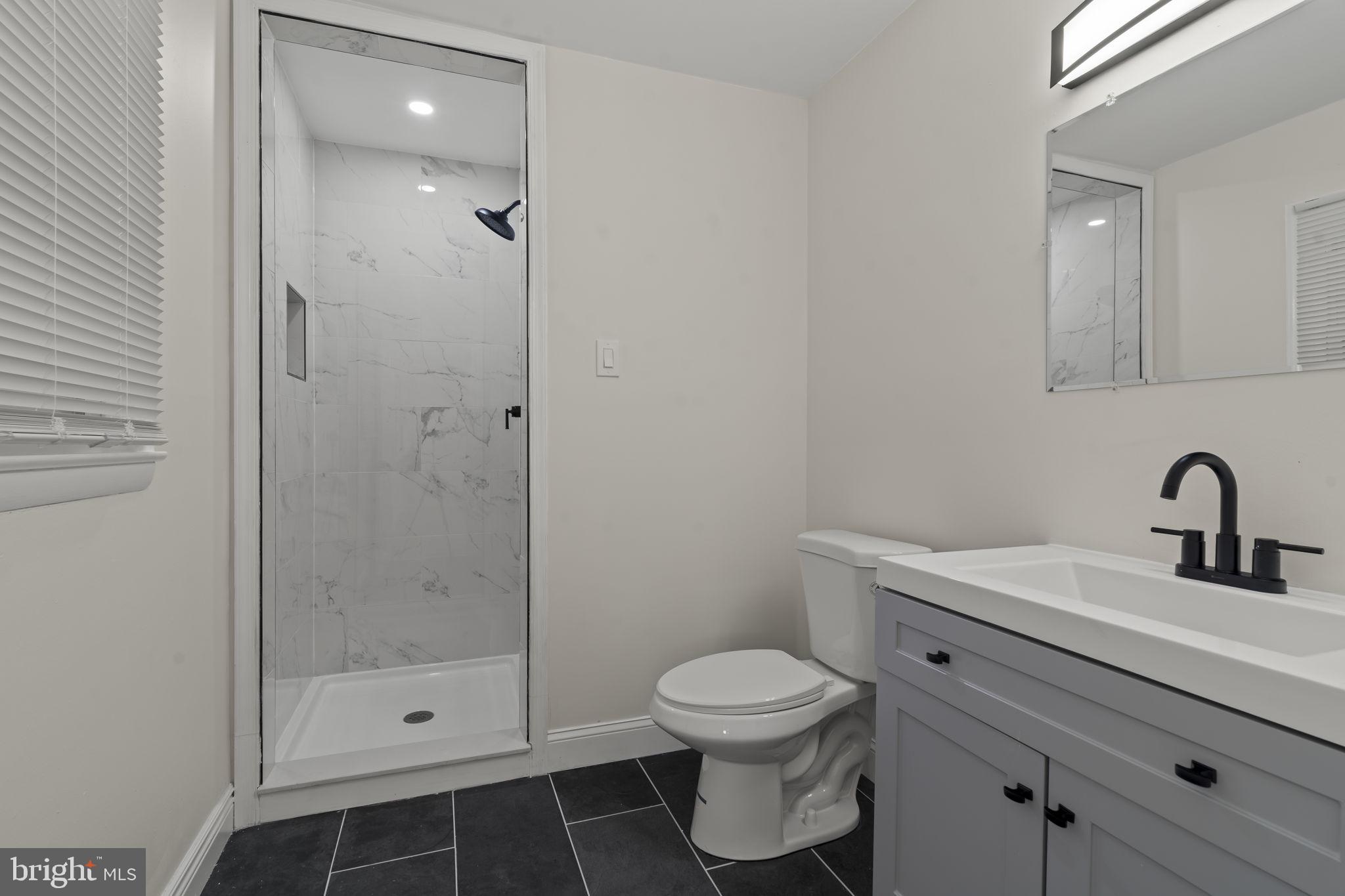 220 Glendale Road Havertown, PA 19083 - Photo 20 of 29 a bathroom with a shower a toilet and sink