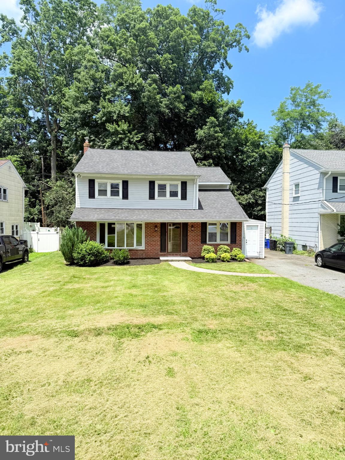 220 Glendale Road Havertown, PA 19083 - Photo 2 of 29 a front view of a house with a garden and trees