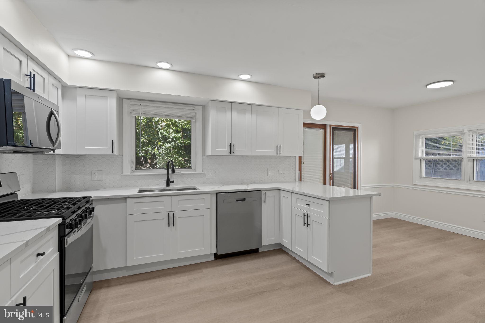 220 Glendale Road Havertown, PA 19083 - Photo 23 of 29 a kitchen that has a lot of white cabinets and stainless steel appliances