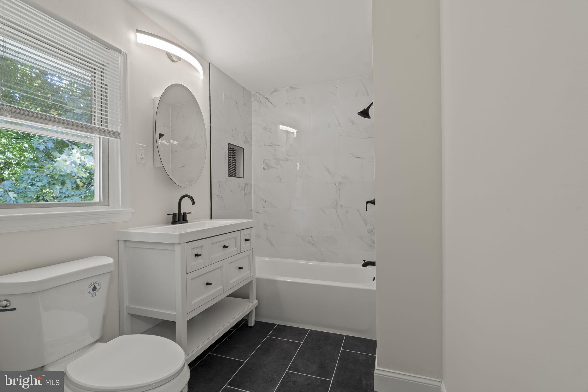 220 Glendale Road Havertown, PA 19083 - Photo 24 of 29 a bathroom with a sink a toilet and a mirror