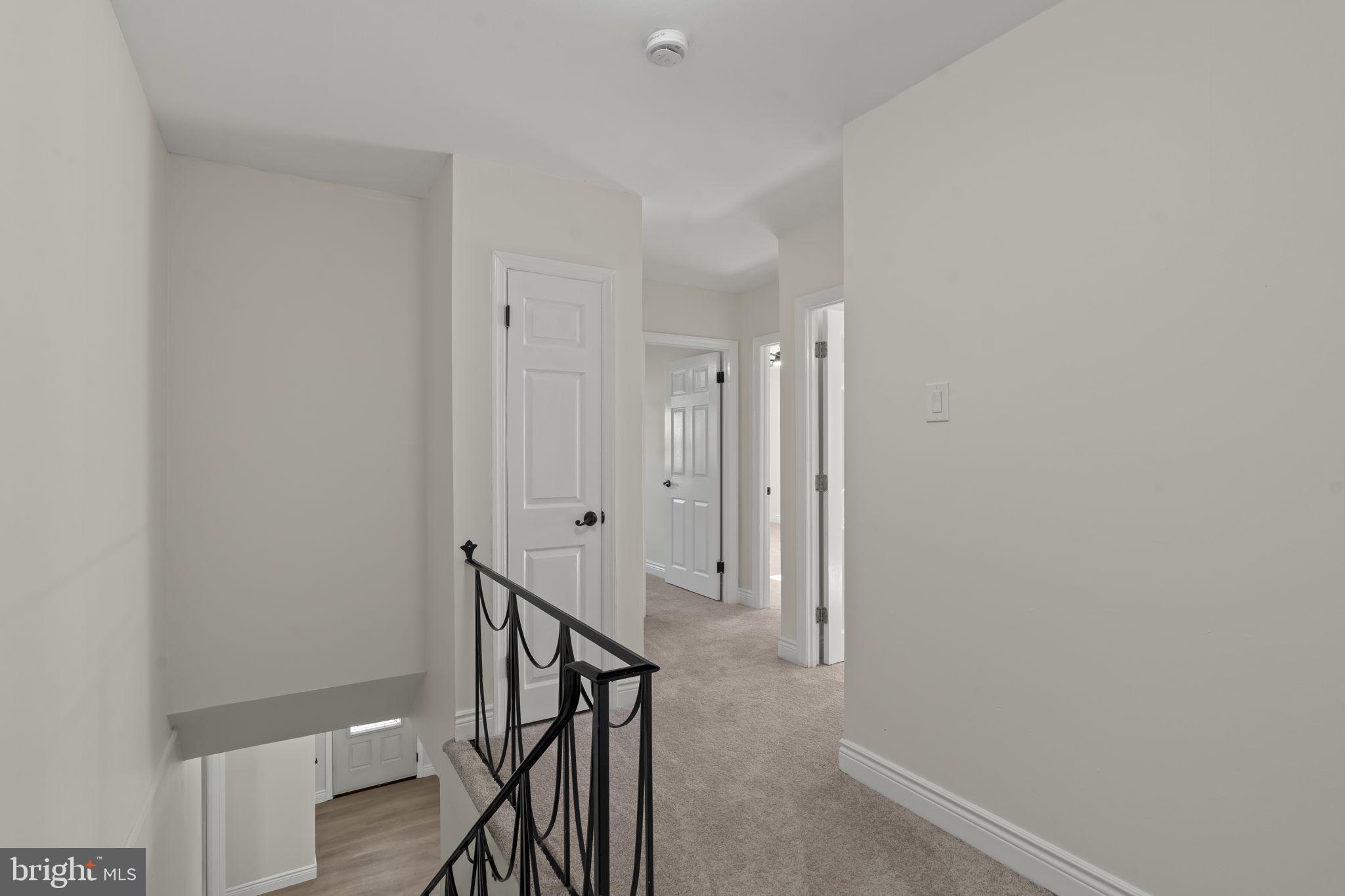220 Glendale Road Havertown, PA 19083 - Photo 27 of 29 a view of a hallway with wooden floor and entryway
