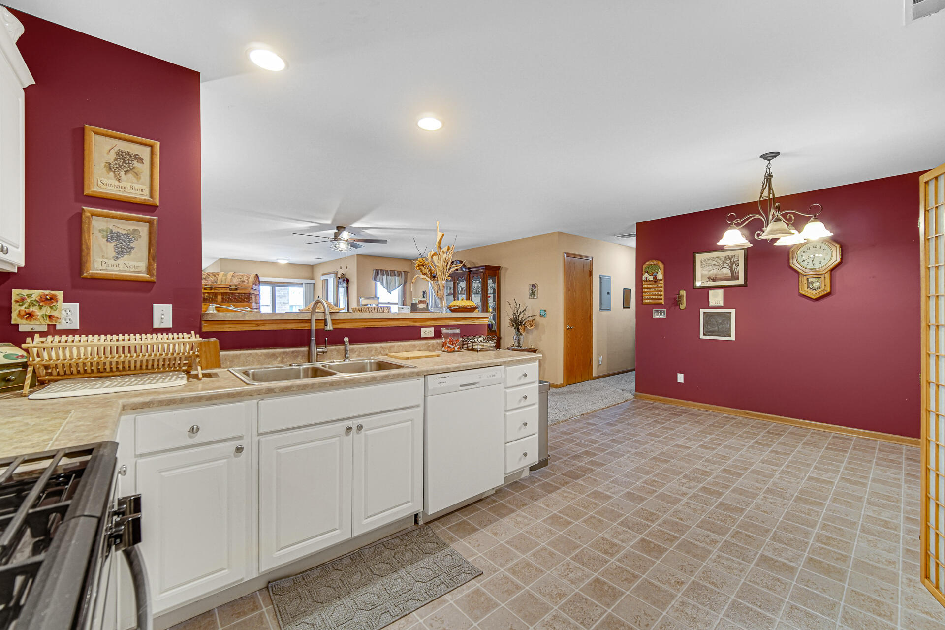 947 Oak Drive Crown Point, IN 46307 - Photo 11 of 23 a kitchen with granite countertop a sink cabinets and stove