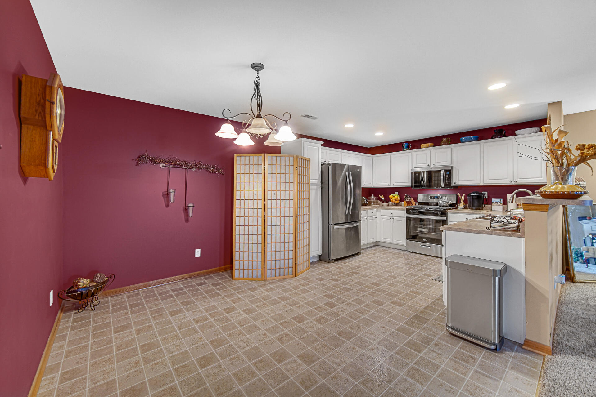 947 Oak Drive Crown Point, IN 46307 - Photo 12 of 23 a kitchen with refrigerator and window