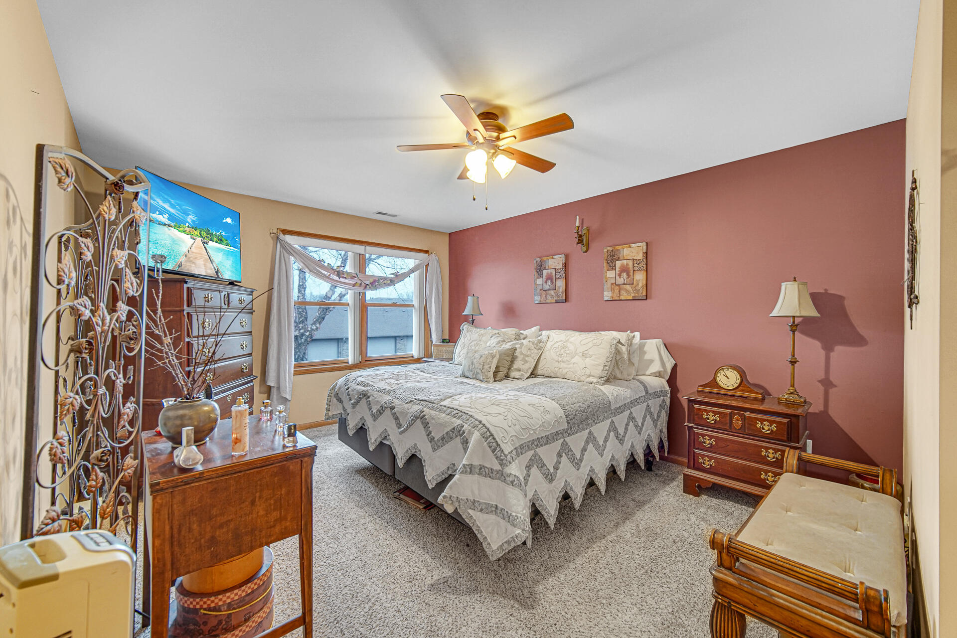 947 Oak Drive Crown Point, IN 46307 - Photo 13 of 23 a spacious bedroom with a bed and a chandelier