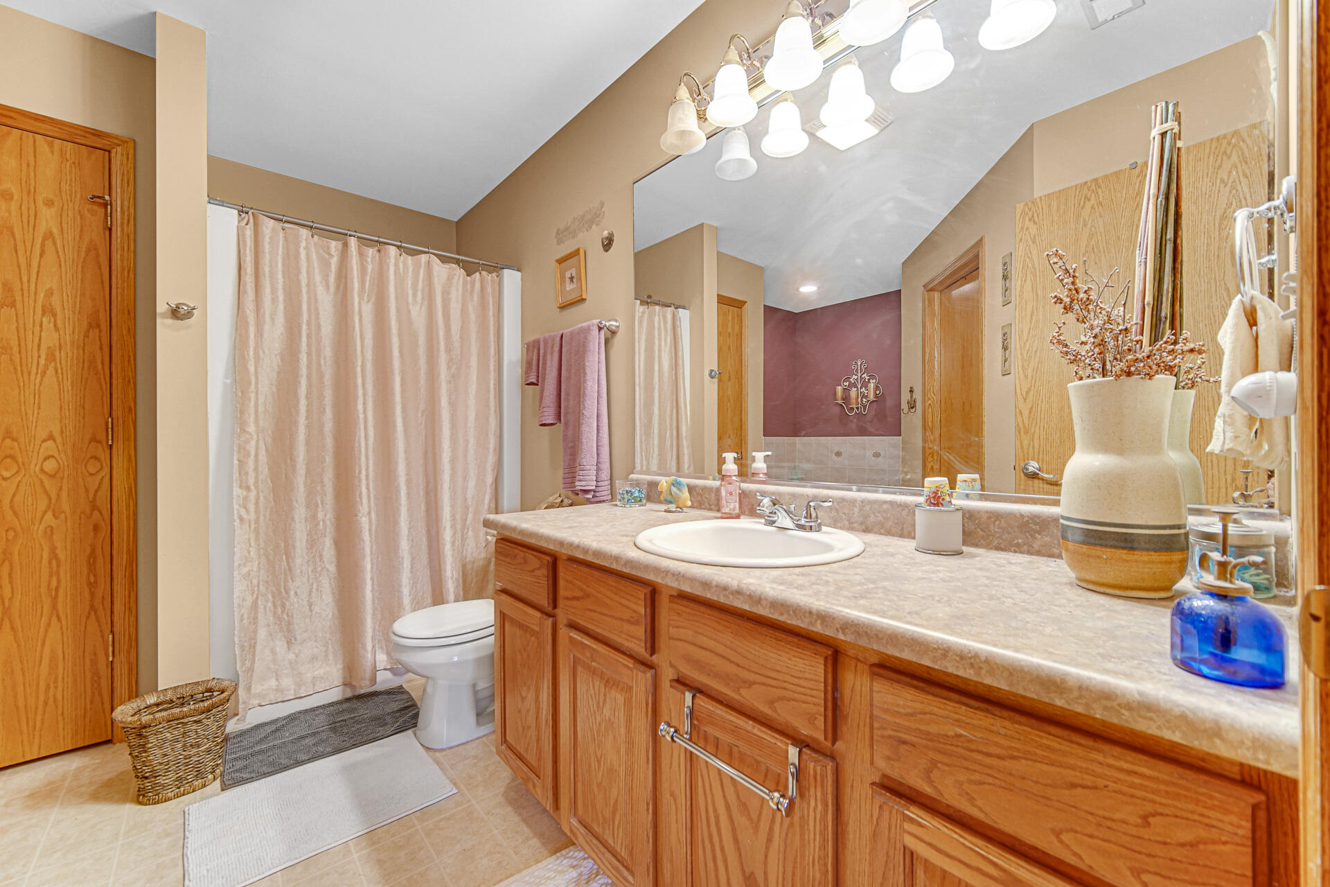 947 Oak Drive Crown Point, IN 46307 - Photo 16 of 23 a bathroom with a double vanity sink and a mirror