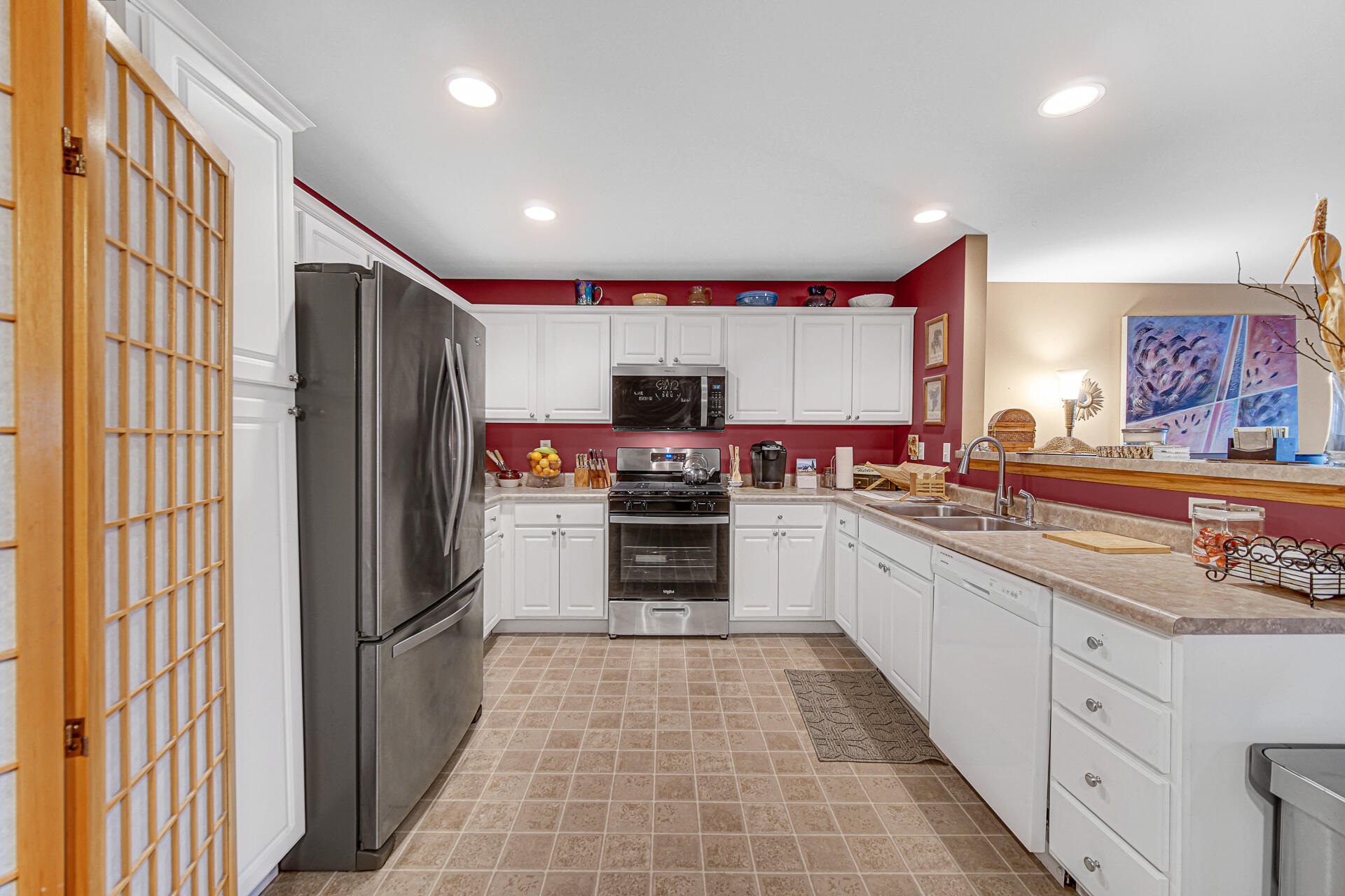 947 Oak Drive Crown Point, IN 46307 - Photo 9 of 23 a kitchen with stainless steel appliances granite countertop a refrigerator and a stove