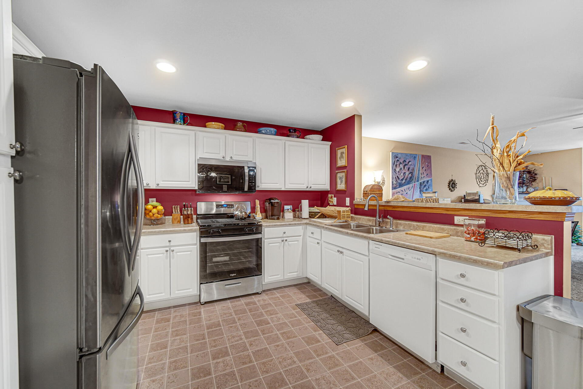947 Oak Drive Crown Point, IN 46307 - Photo 10 of 23 a kitchen with stainless steel appliances granite countertop a refrigerator and a sink