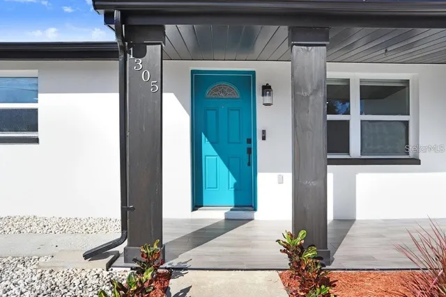 a bedroom with a bed and a table