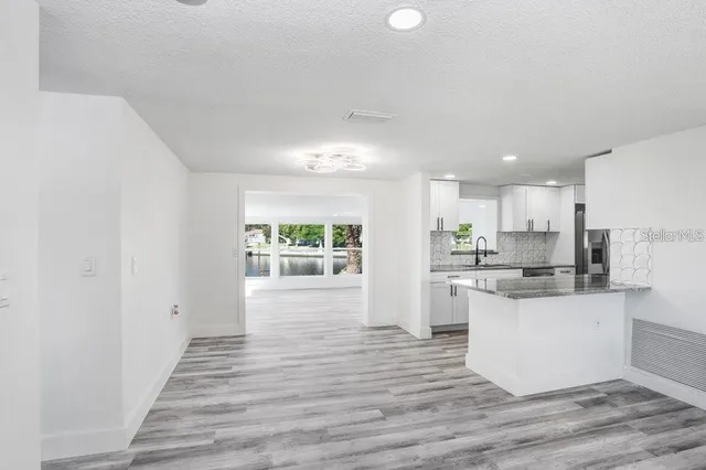 an aerial view of a house with a lake view