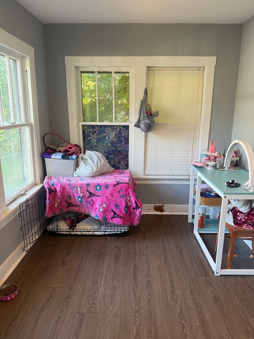 10-12 South Somonauk Road Cortland, IL 60112 - Photo 15 of 29 a bedroom with a bed and a wooden floor