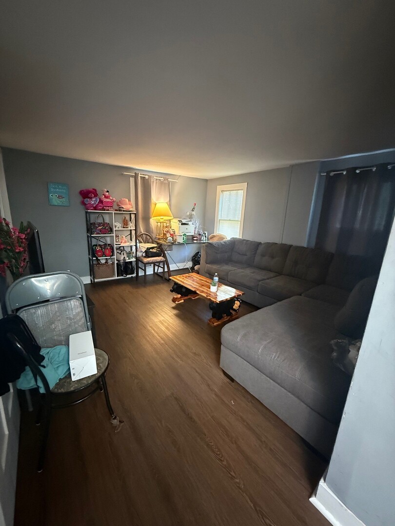 10-12 South Somonauk Road Cortland, IL 60112 - Photo 17 of 29 a living room with furniture and a flat screen tv