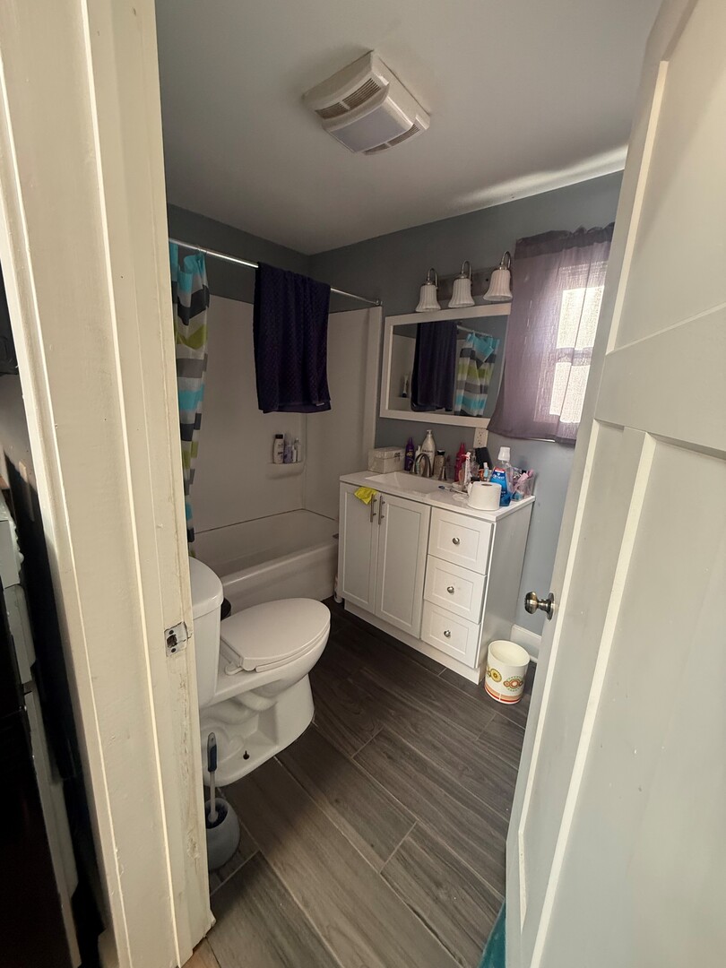 10-12 South Somonauk Road Cortland, IL 60112 - Photo 18 of 29 a bathroom with a toilet a sink and a mirror