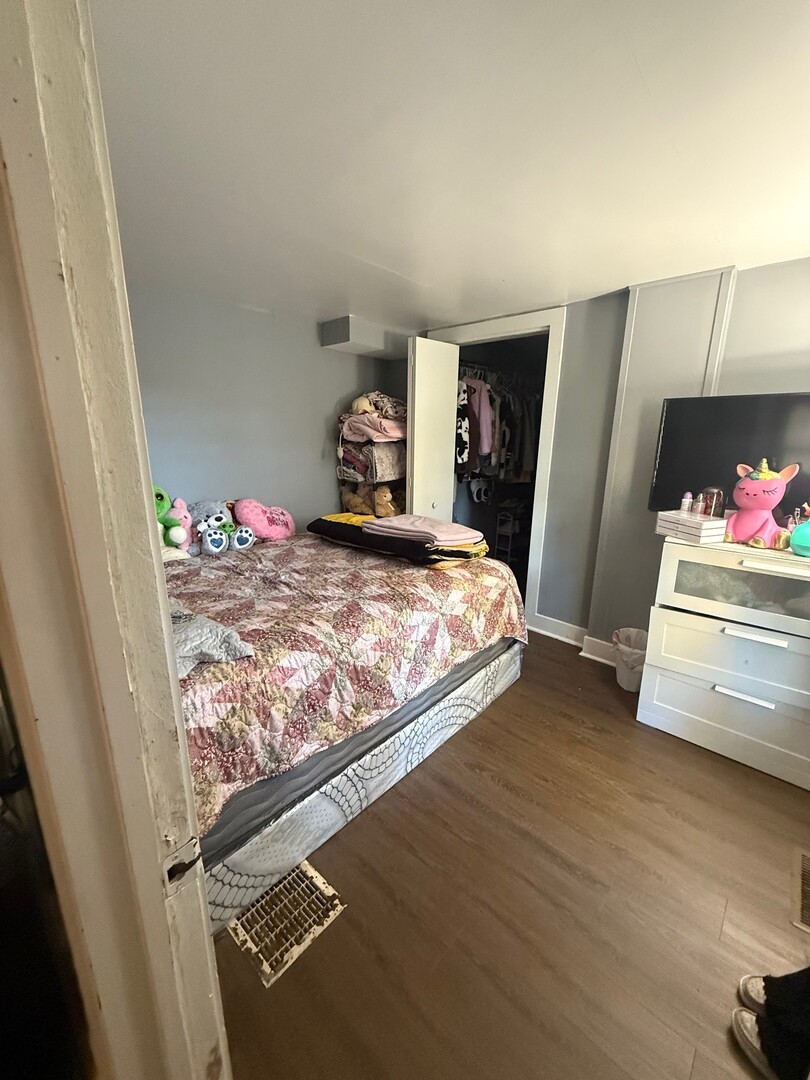 10-12 South Somonauk Road Cortland, IL 60112 - Photo 19 of 29 a bedroom with a bed and a window