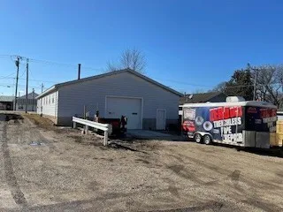 a view of a chairs and tables in the back yard of the house