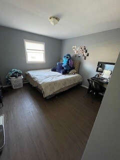 10-12 South Somonauk Road Cortland, IL 60112 - Photo 5 of 29 a bedroom with a bed and a chandelier