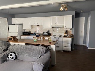 10-12 South Somonauk Road Cortland, IL 60112 - Photo 7 of 29 a living room with stainless steel appliances furniture cabinets and a wooden floor