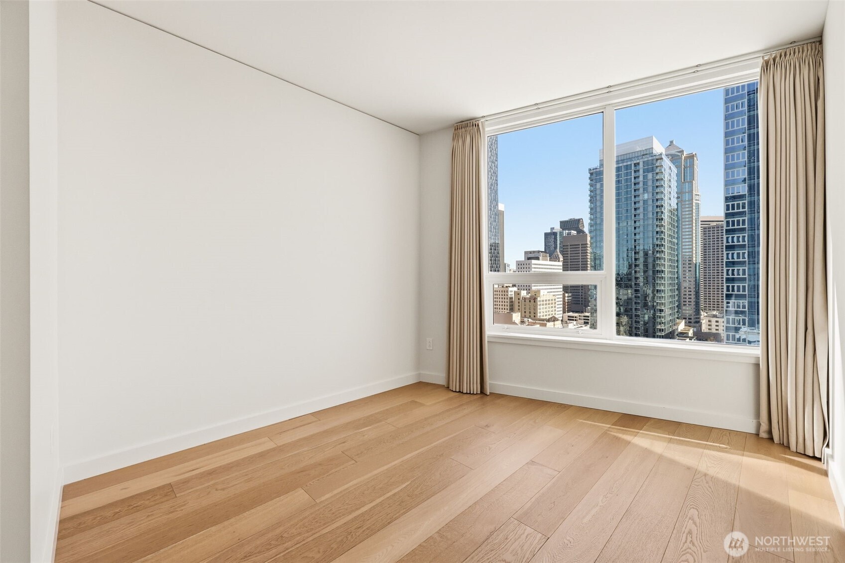 121 Stewart Street, Unit 1803 Seattle, WA 98101 - Photo 12 of 28 a view of an empty room with a window