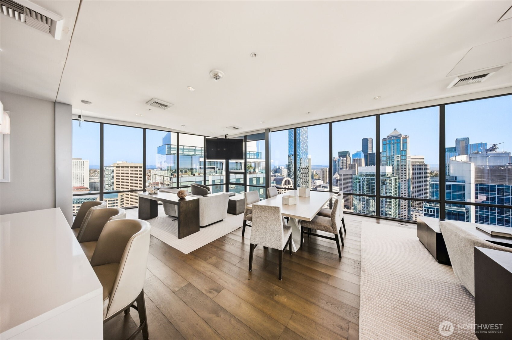 121 Stewart Street, Unit 1803 Seattle, WA 98101 - Photo 25 of 28 a living room with furniture and a large window
